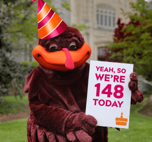 Image of Hokie Bird holding 148th birthday sign.